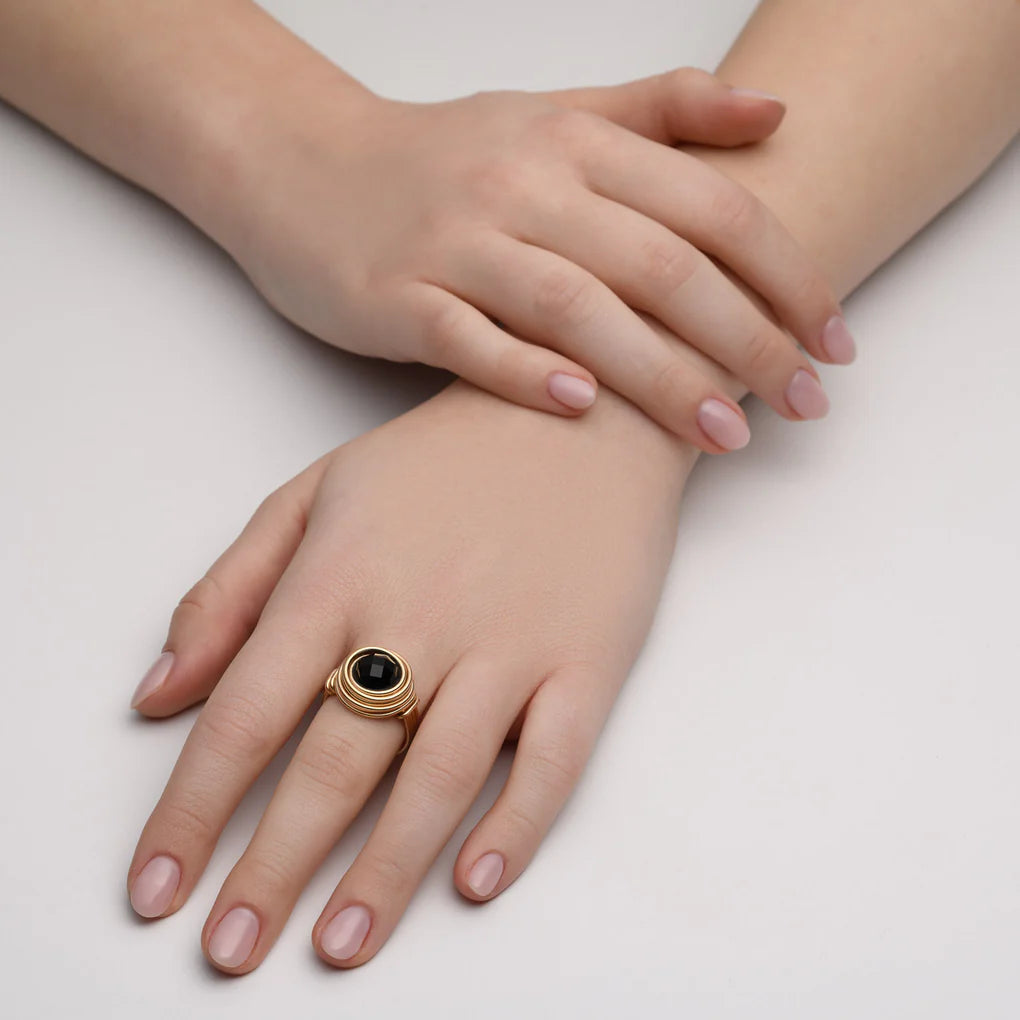 Universe Onyx Ring featuring a large faceted black onyx stone set in high-quality gold-filled spirals