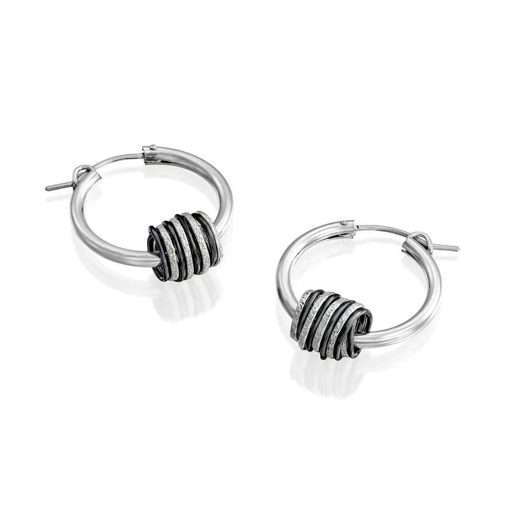 Rolling hoop earrings with silver and blackened 999 silver swirls, handcrafted design.