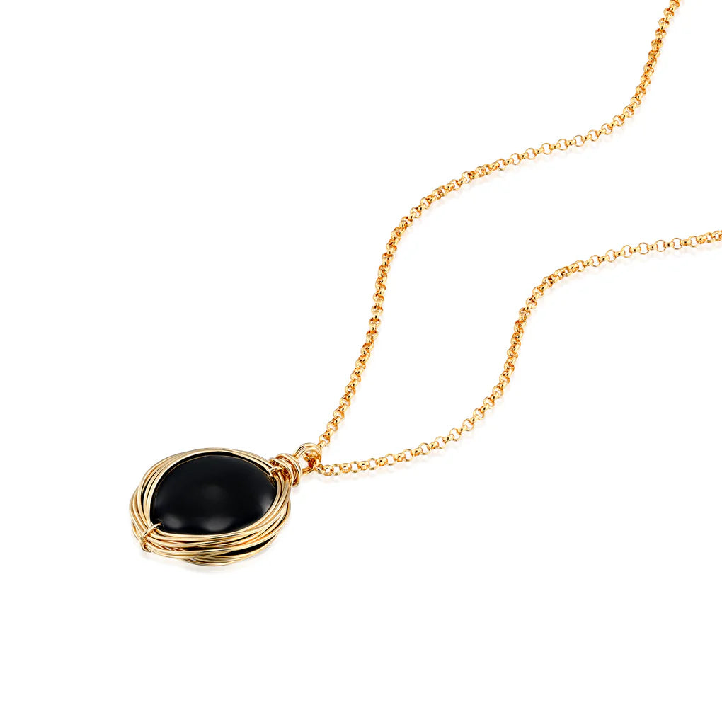 Universe Coin Onyx Necklace featuring a natural coin-shaped black onyx set in a gold-filled spiral pendant