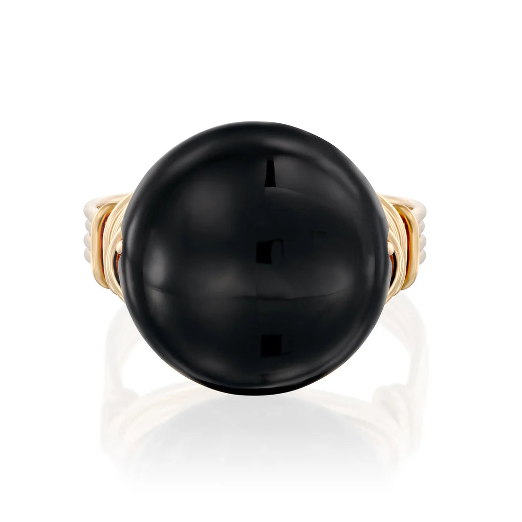 Universe Coin Onyx Ring featuring a natural coin-shaped black onyx stone set in layered gold-filled spirals
