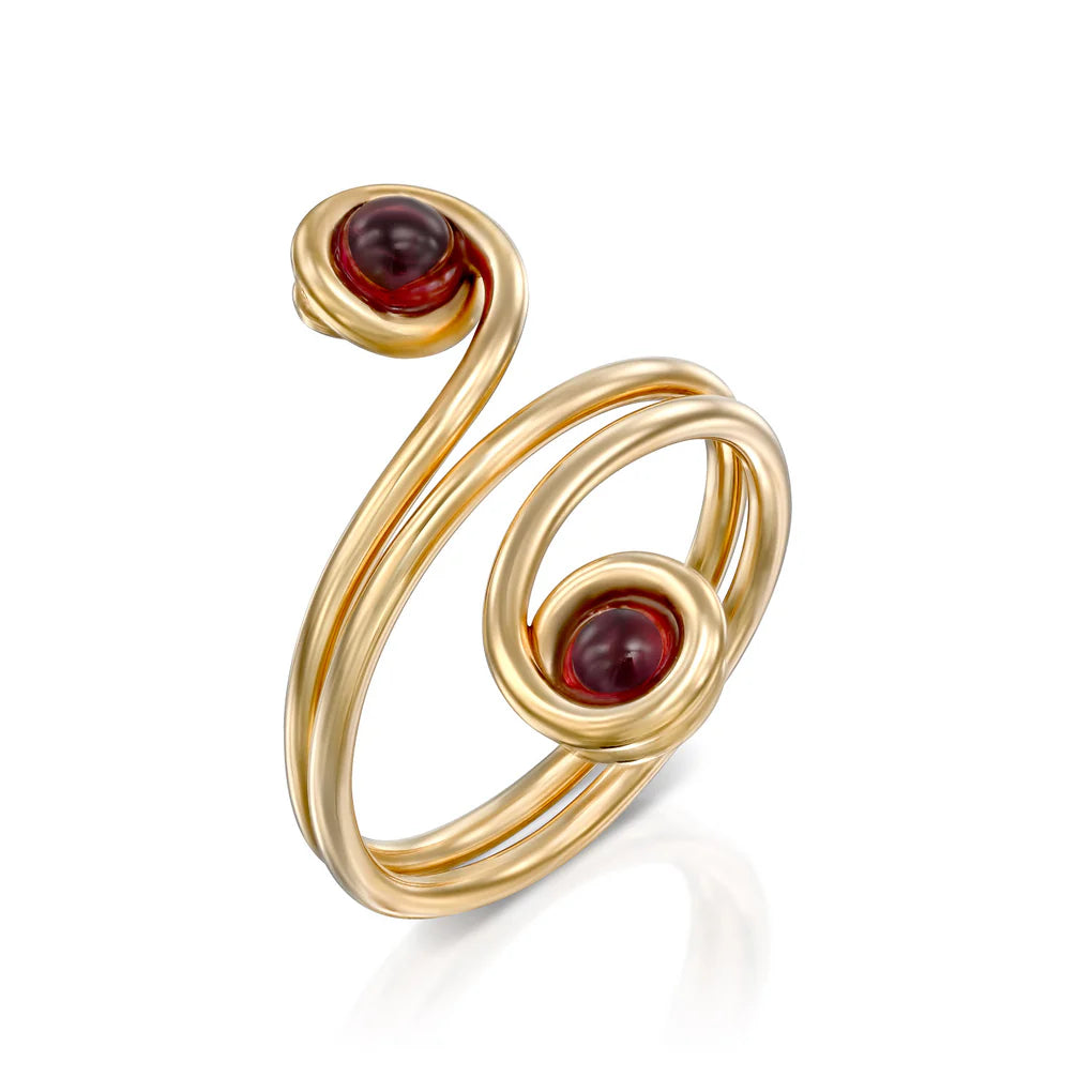 Universe Swirl Garnet Ring featuring two natural garnet stones set in flowing gold-filled spiral design