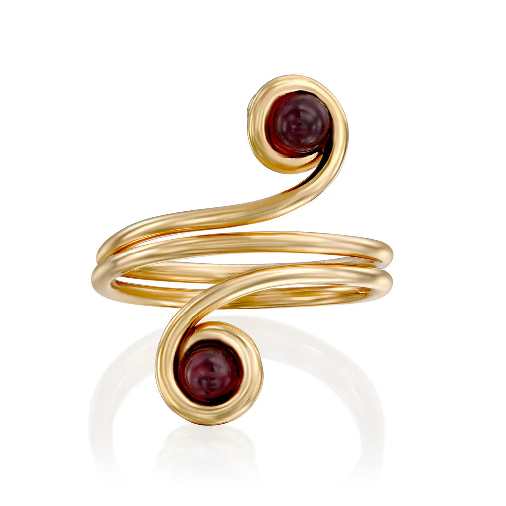 Universe Swirl Garnet Ring featuring two natural garnet stones set in flowing gold-filled spiral design