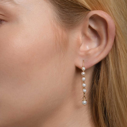 Long Pearl Spirali Earrings with high-quality pearls and gold-filled accents, handcrafted design.
