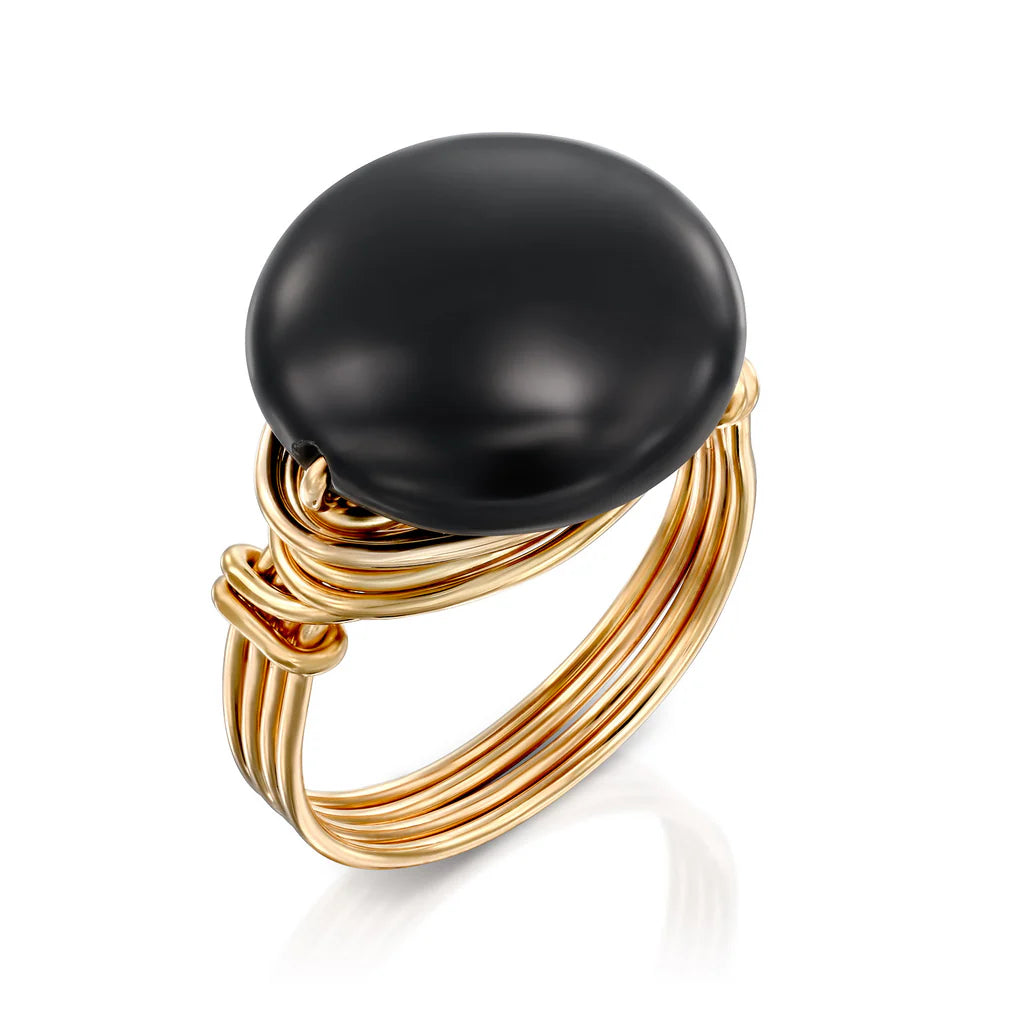 Universe Coin Onyx Ring featuring a natural coin-shaped black onyx stone set in layered gold-filled spirals